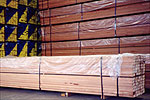 Timber being wrapped up in plastic sheets before being exported